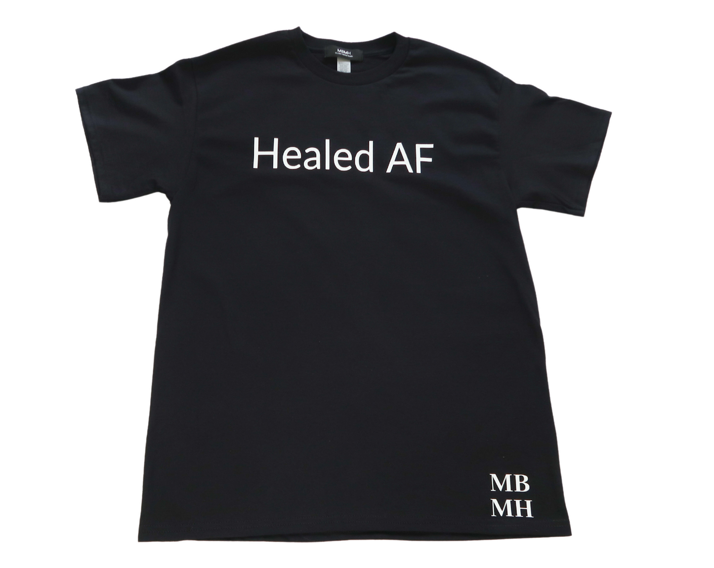 Short sleeve black colored t-shirt with white vinyl lettering with phrase “Healed AF”