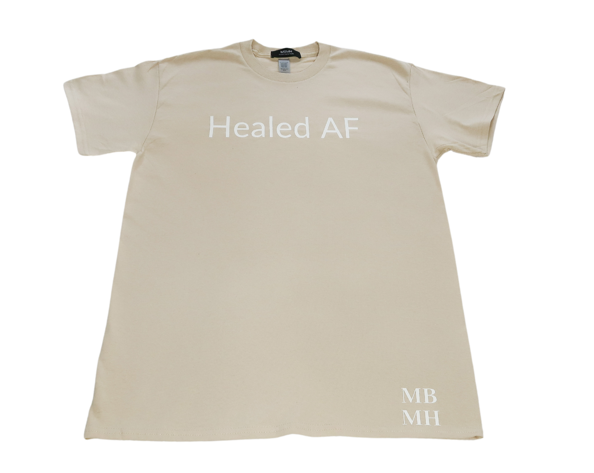 Short sleeve sand colored t-shirt with white vinyl lettering with phrase “Healed AF”